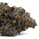 Jessica Rabbit Indoor THCa Flower with dense green purple buds and frosty trichomes